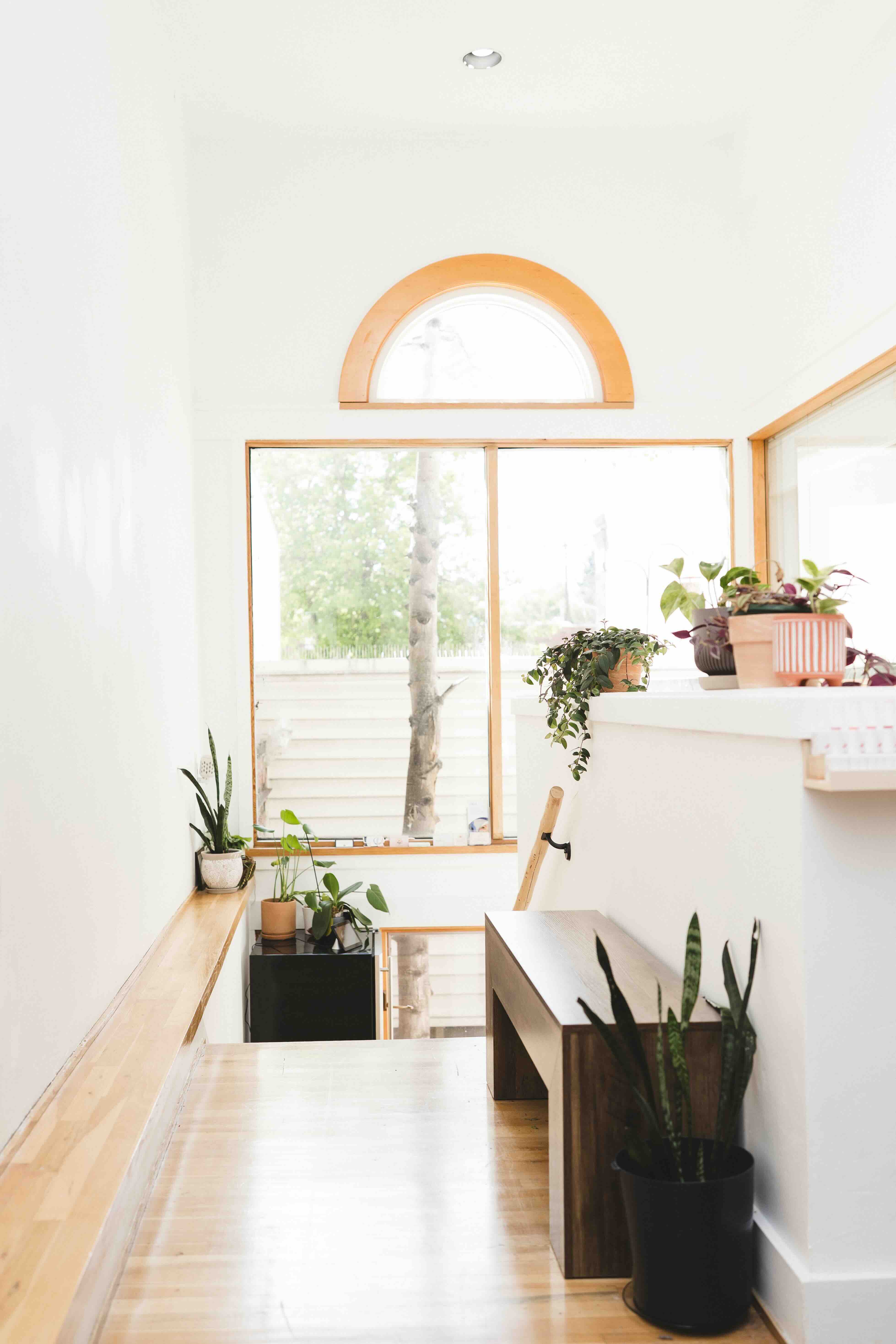 Welcoming salon reception area with flowers and warm lighting