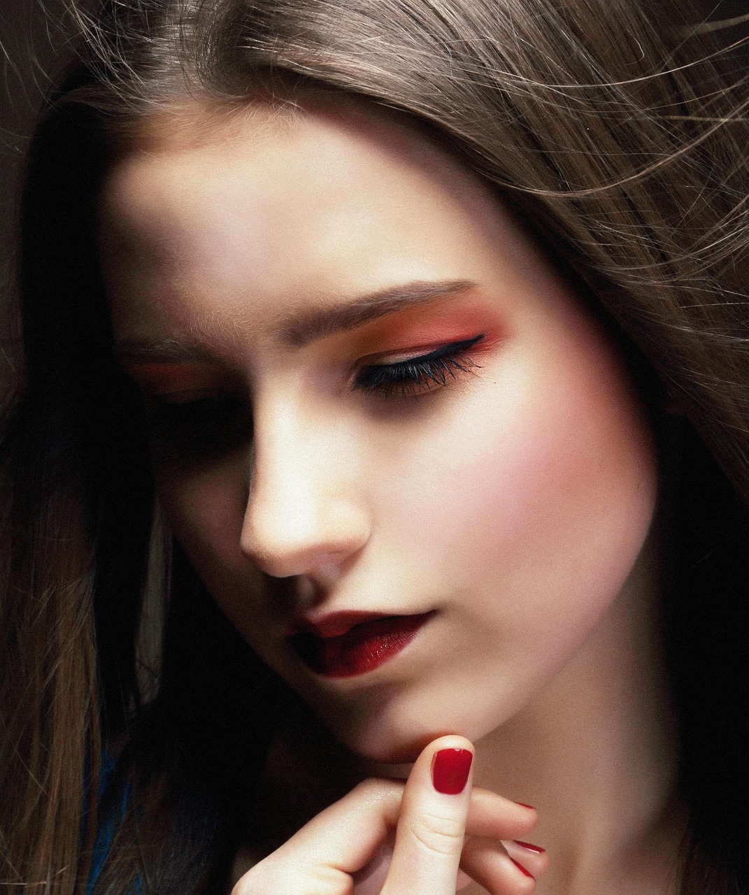 Close-up portrait showcasing permanent makeup — defined brows and polished look