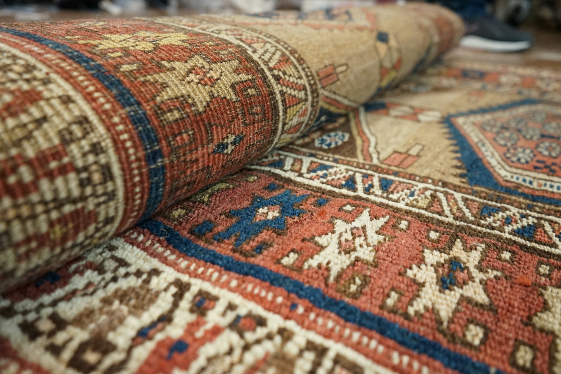 Richly patterned area rugs displayed in a specialist cleaning facility