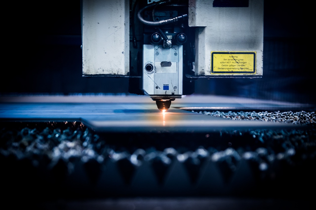 CNC plasma cutting — machine cutting metal plate with sparks