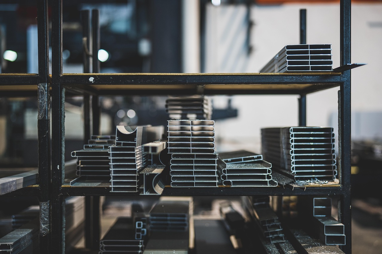 Steel supply — raw steel and aluminum stock in warehouse