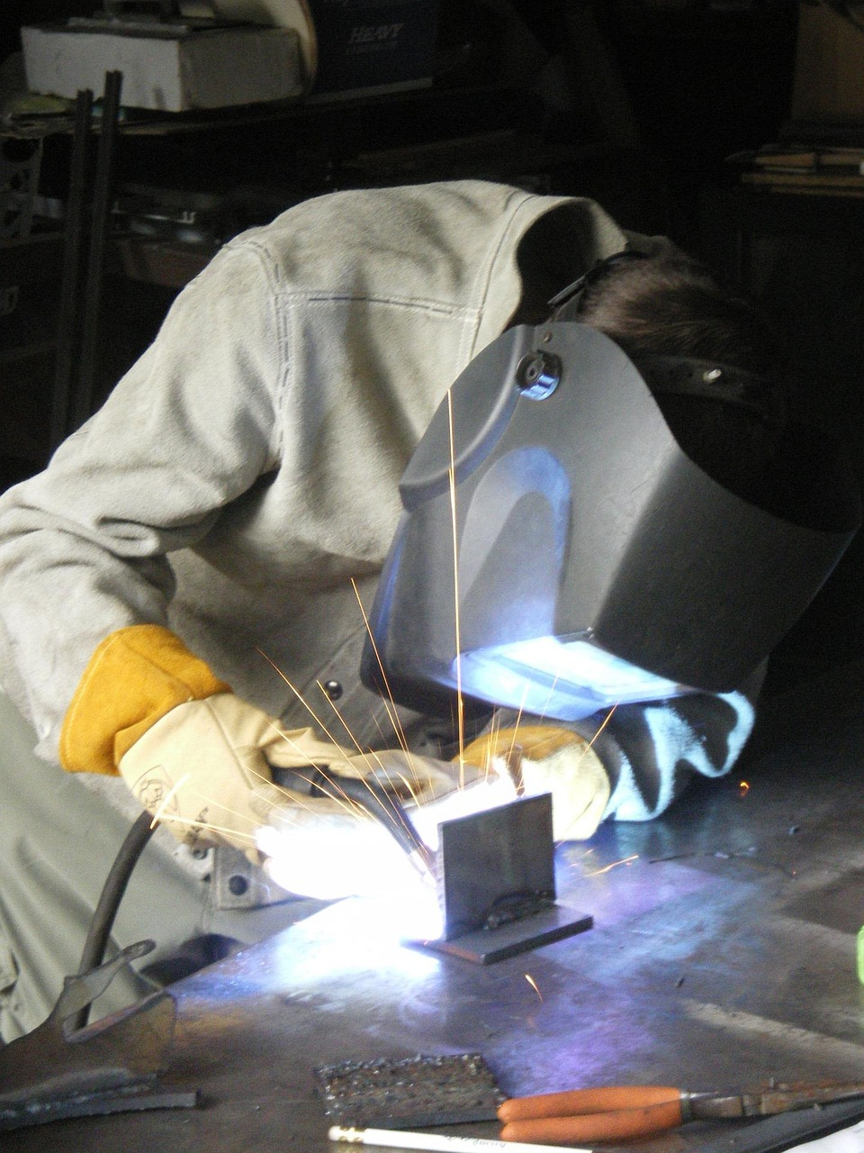 Custom fabrication — certified welder at work in the shop