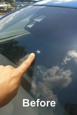 Windshield before rock chip repair — visible chip damage
