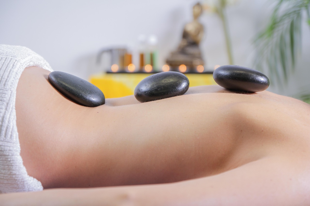 Hot stone massage with heated basalt stones placed along the back